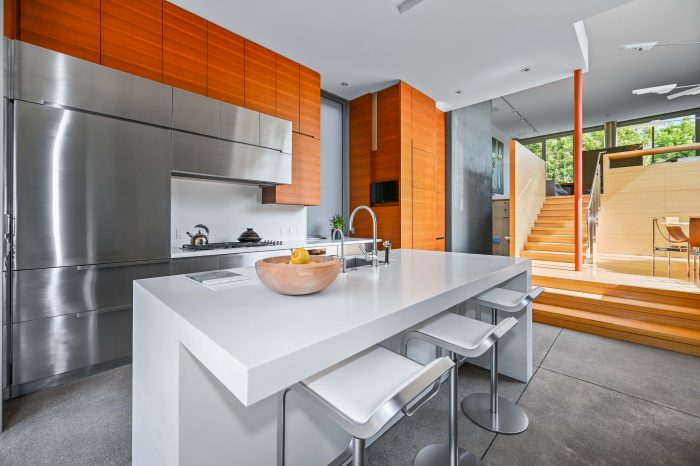modern kitchen with stairs to living area