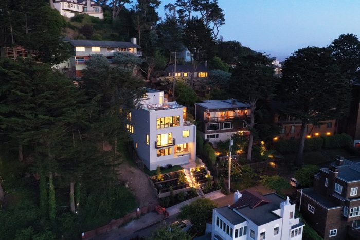 Spanning approximately 5,395 square feet backing into abundant nature space, 127 Edgehill Way is listed by Annetta Rosenstein.