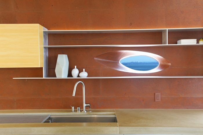 Sink with oval window overlooking San Francisco.