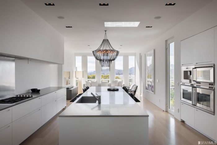 Modernist kitchen all white with built-ins