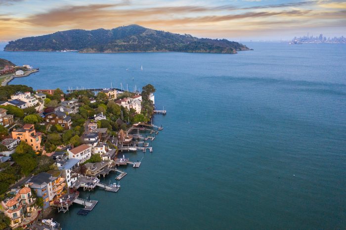 Aerial view of Belvedere homes with Angel Island in the background.