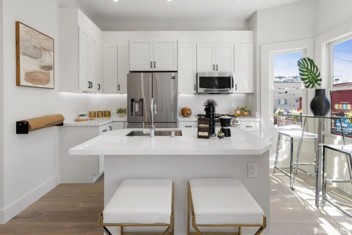 Modernist white kitchen with quartz countertops