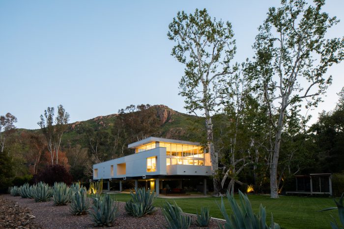 view of home at sunset