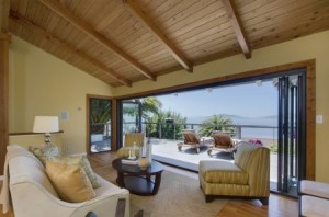 BeachfrontWindow A wall of glass opens onto a deck