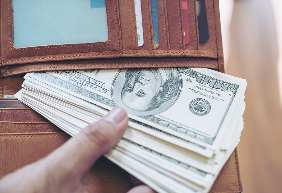 US dollar money banknote in full wallet