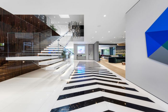 Malerba chandeliers grace a dramatic foyer.