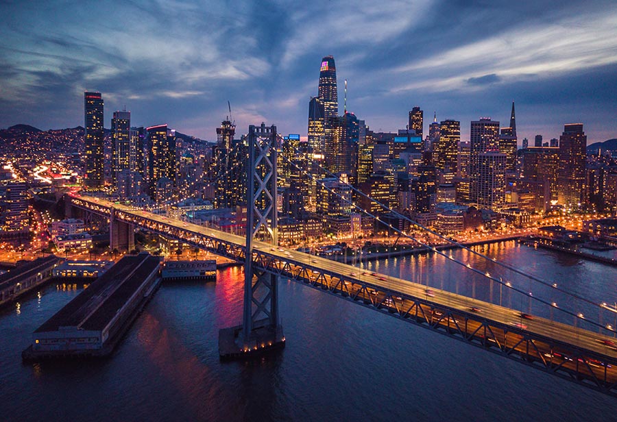 Aerial Cityscape view of San Francisco and the Bay Bridge at Night, California, USA