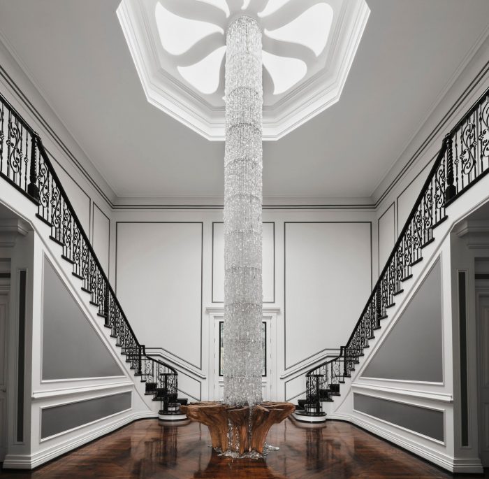 Foyer with floor to ceiling Swarovski chandelier.