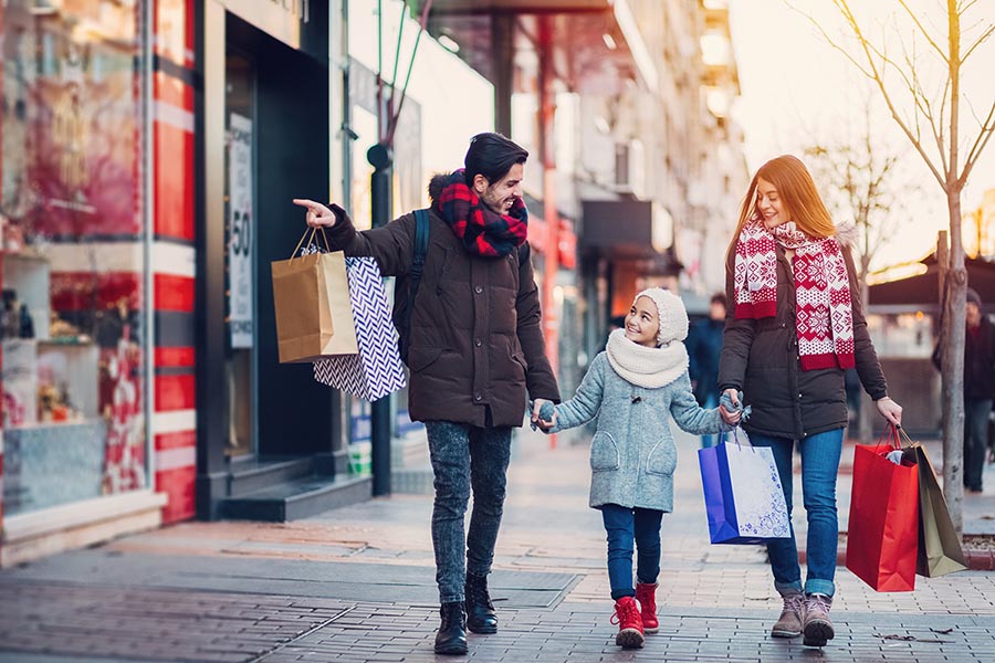 Family with one kid shopping together