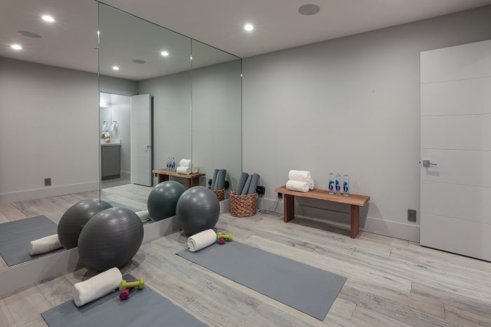 Workout room with mirrors, and all the equipment for yoga type workouts.