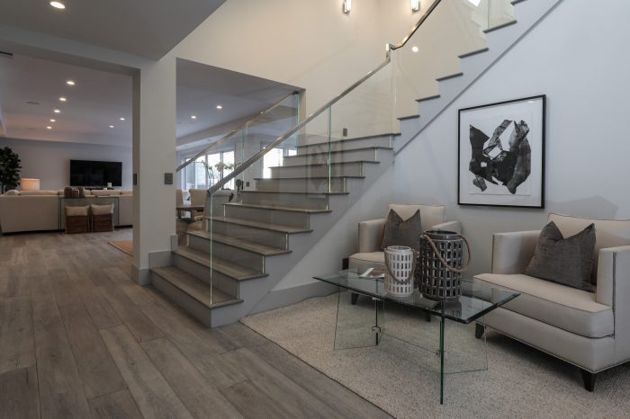 Staircase and transition room with modern art.