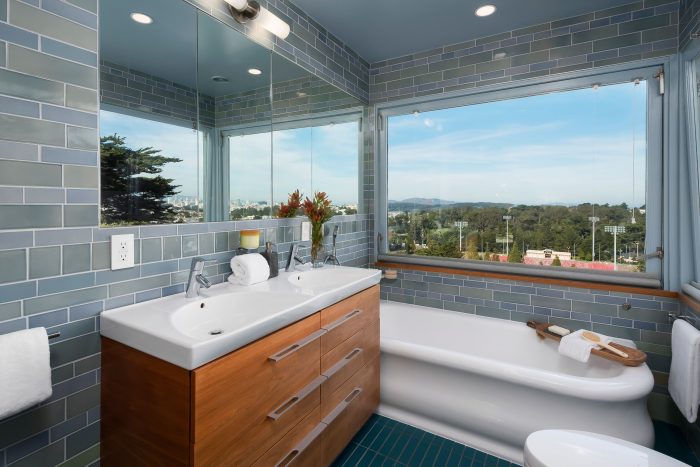 Tiled bathroom with luxurious tub, overlooking Kezar stadium.