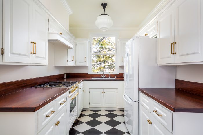 White vintage kitchen black and white tile flooring