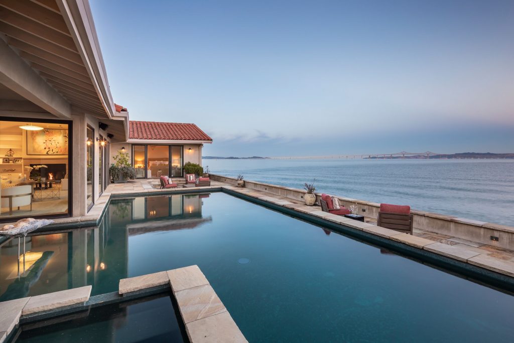 Showing Bayfront home outside pool view